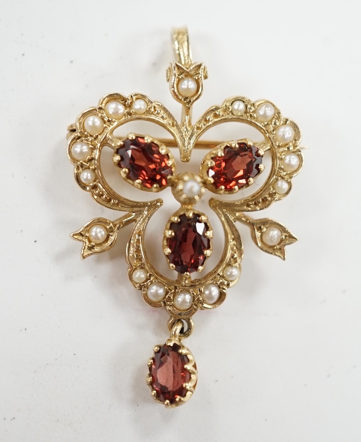 A Victorian style 9ct gold, garnet and seed pearl set drop pendant brooch, overall 39mm, gross weight 5.7 grams. Condition - fair to good